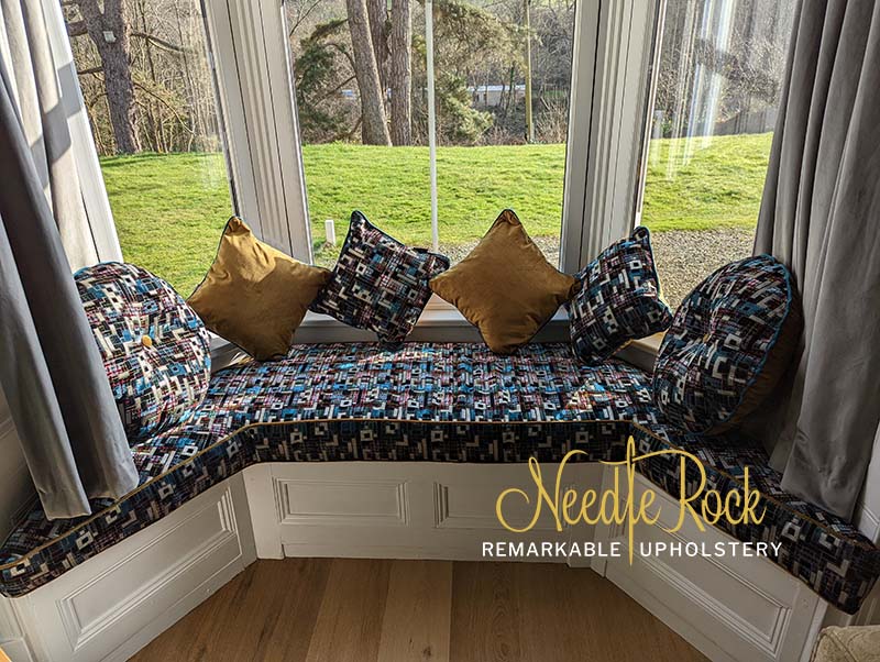 Large irregular shaped window seat using Designers Guild fabric.