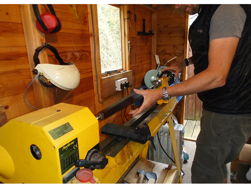 Gord hard at work using the lathe for woodwork in the workshop