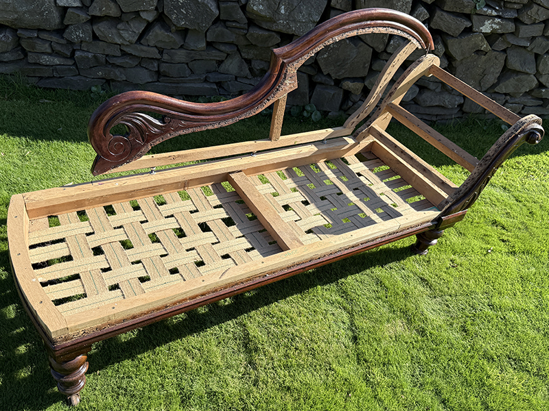 Antique chaise longue frame with decorative arm