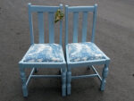 Pair of painted utility chairs. Pair of drop-in utility chairs, painted and covered in a blue-toile fabric.