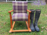 Child's Rocking Chair Child's Rocking Chair with purple plaid fabric (and wellies to emphasis it's smallness).