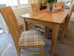 Tartan dining chairs in caravan. Tartan covered dining chairs in a static caravan.