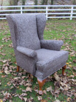Grey Parker Knoll Masculine Parker Knoll covered in a light-reflective grey fabric.