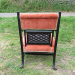 Upholstered spindle chair Black elaborate upholstered spindle chair with orange upholstery