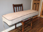 Church pew box cushion. Box cushion prepared for a church pew in a kitchen.