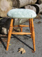 Upholstered modern stool. Modern wooden stool with a comfy upholstered seat.