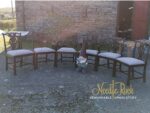 Set of dining chairs covered in a striking geometric design complimenting the wood. Set of dining chairs covered in a striking geometric design complimenting the wood.