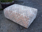 Large pouffe in retro fabric. Large pouffe covered in nostalgic and retro fabric.